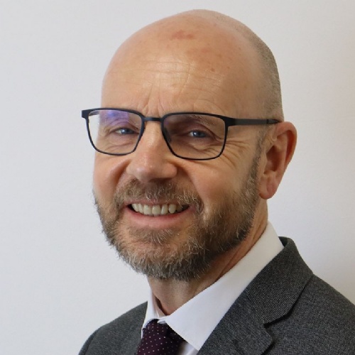 Chris James smiling at the camera