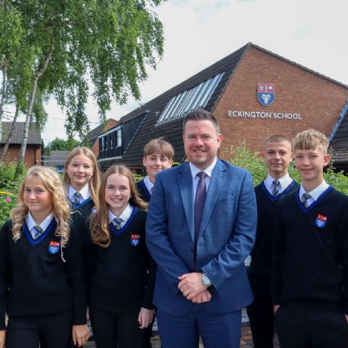 Headteacher Richard Cronin and students celebrating the latest Ofsted report